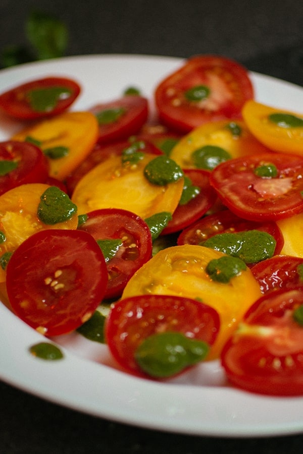 Red and yellow tomatoes with basil paste.