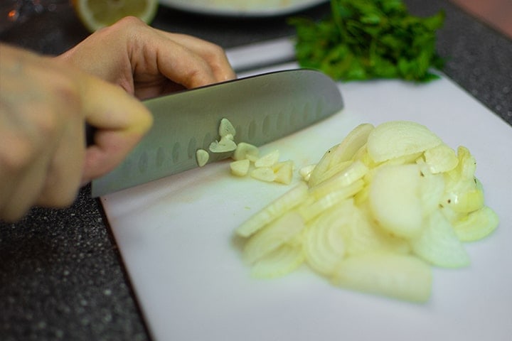 Slicing onions on a cutting board