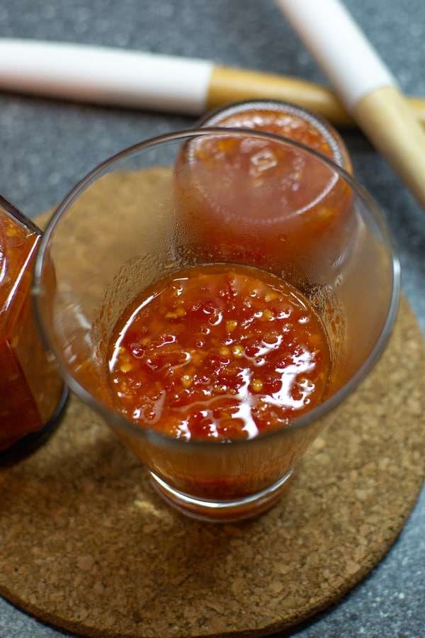 Sweet chili pepper sauce in a glass.