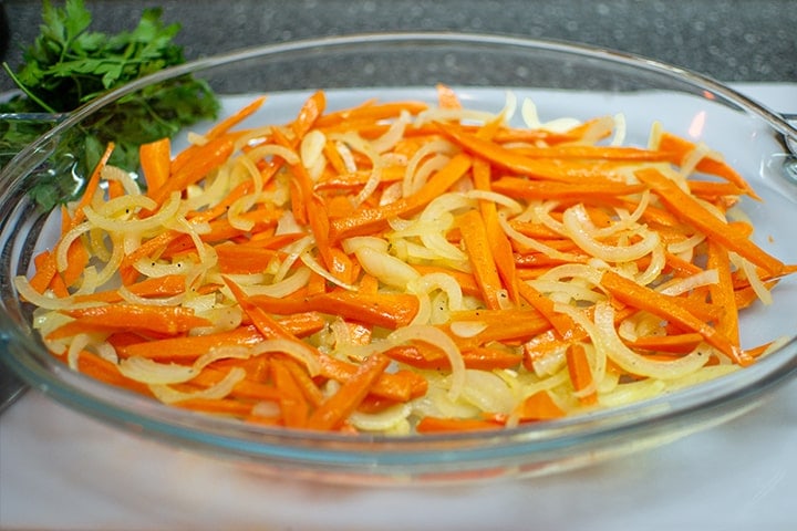 Carrots and onions on a bowl