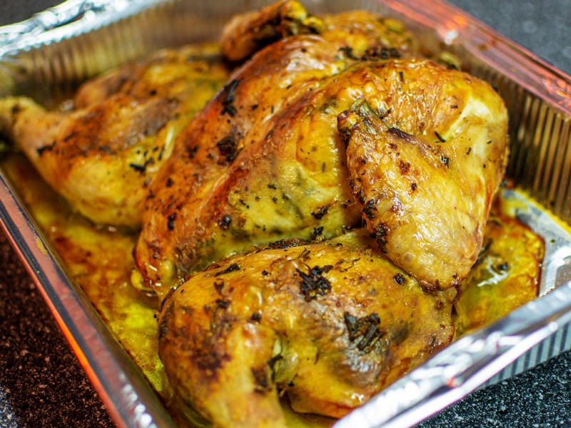 Golden Roasted Whole Chicken on table.