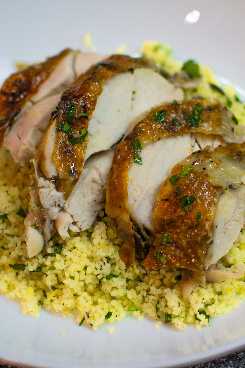 Couscous with roasted chicken with chopped parsley.