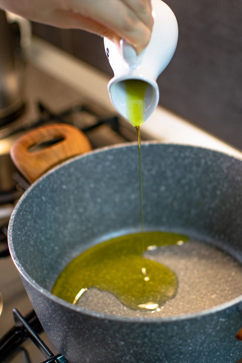 Pouring olive oil in a pan