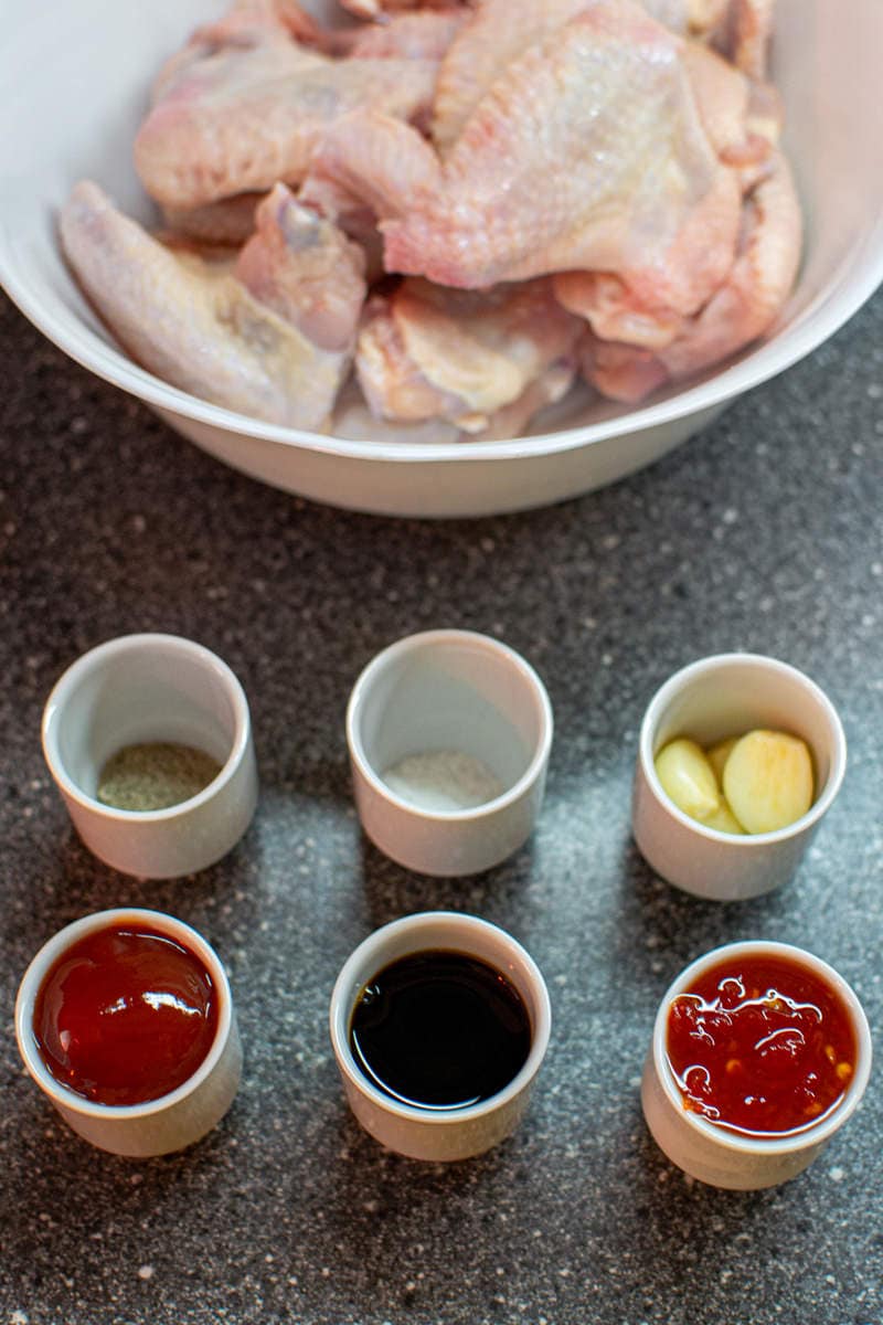 Ingredients for a sweet Chili glazed chicken on a gray table