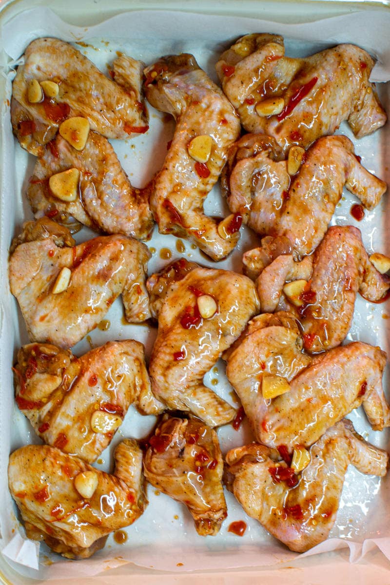 Chicken wings glazed with chili sauce and garlic