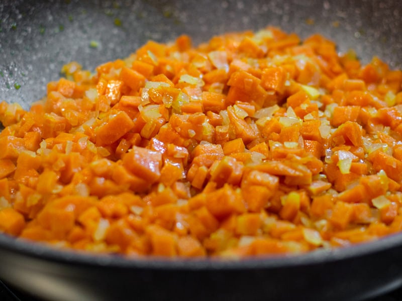 Chopped carrots with onions in a pan