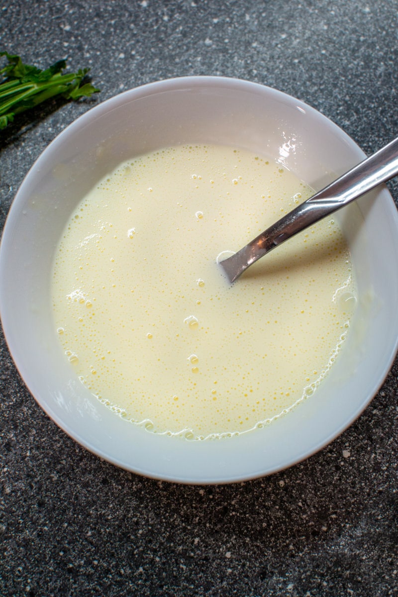 Sour cream with egg and parsley.