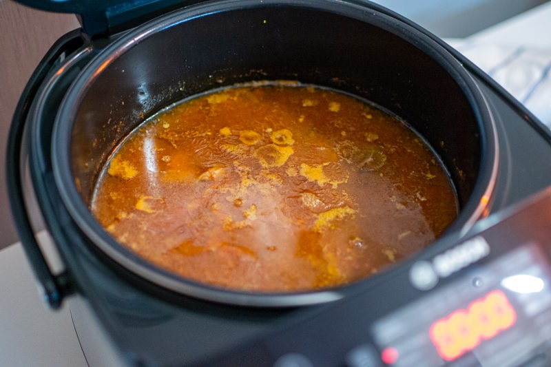 Osso buco sauce in a dark pan.