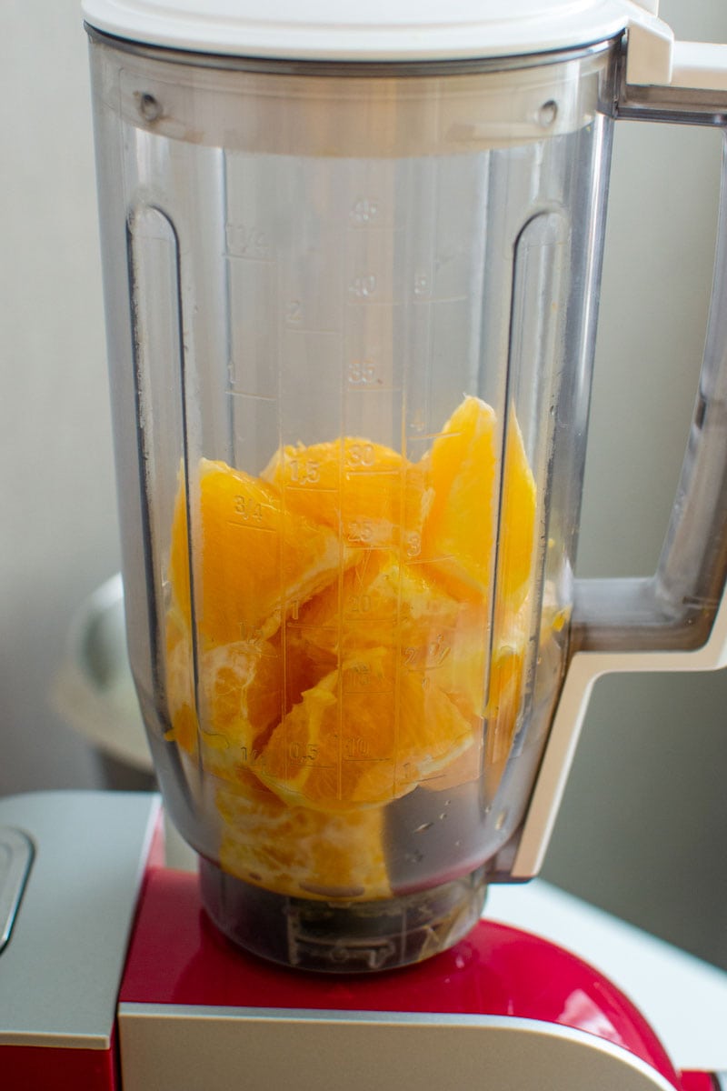 Orange cubes in a transparent blender.