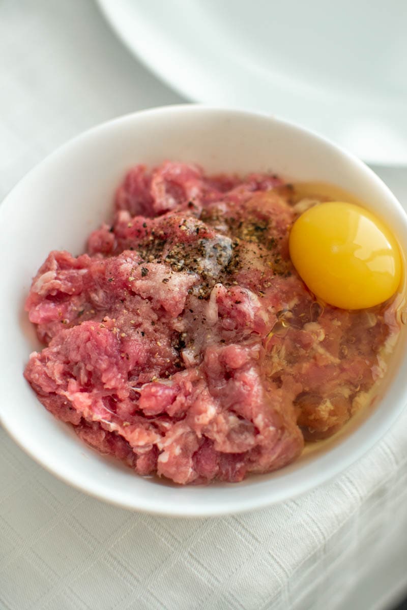 Raw meat with salt, pepper and raw egg.