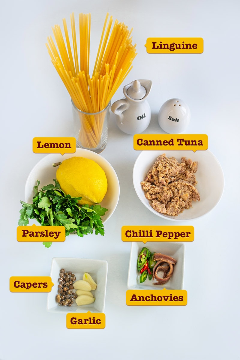 Ingredients for sicilian tuna pasta on white table