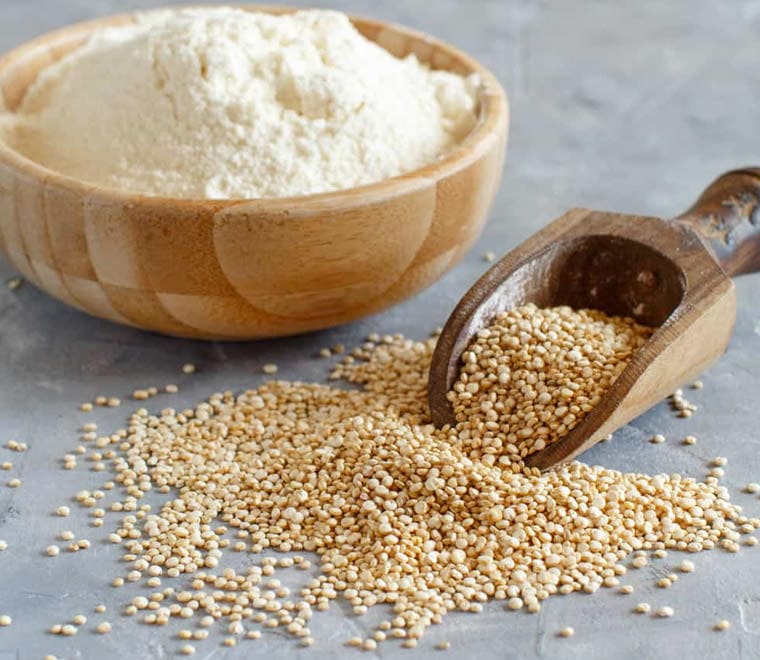 Quinoa Flour on concrete table.
