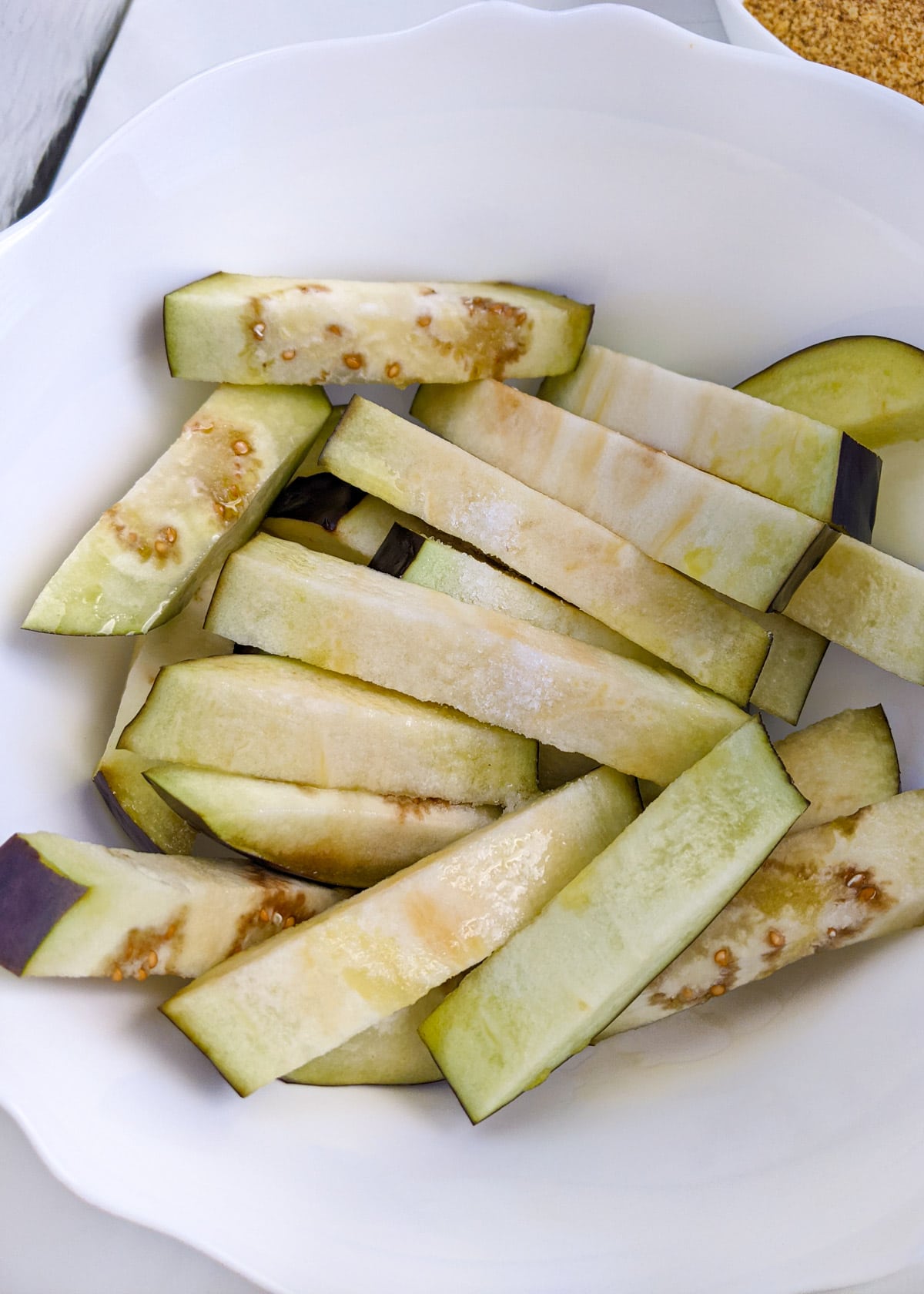 Eggplant slices with salt and oil.