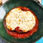 Eggplant parmesan and melted mozzarella with a tomato sauce.