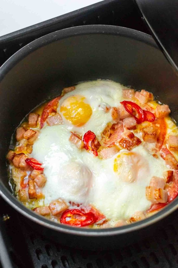 Fried Eggs With Bacon and red peppers in Air Fryer.