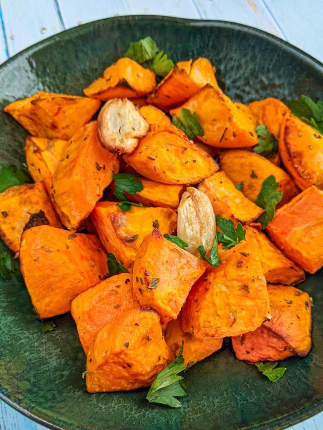 Green plate with Sweet Potato Chunks In Air Fryer