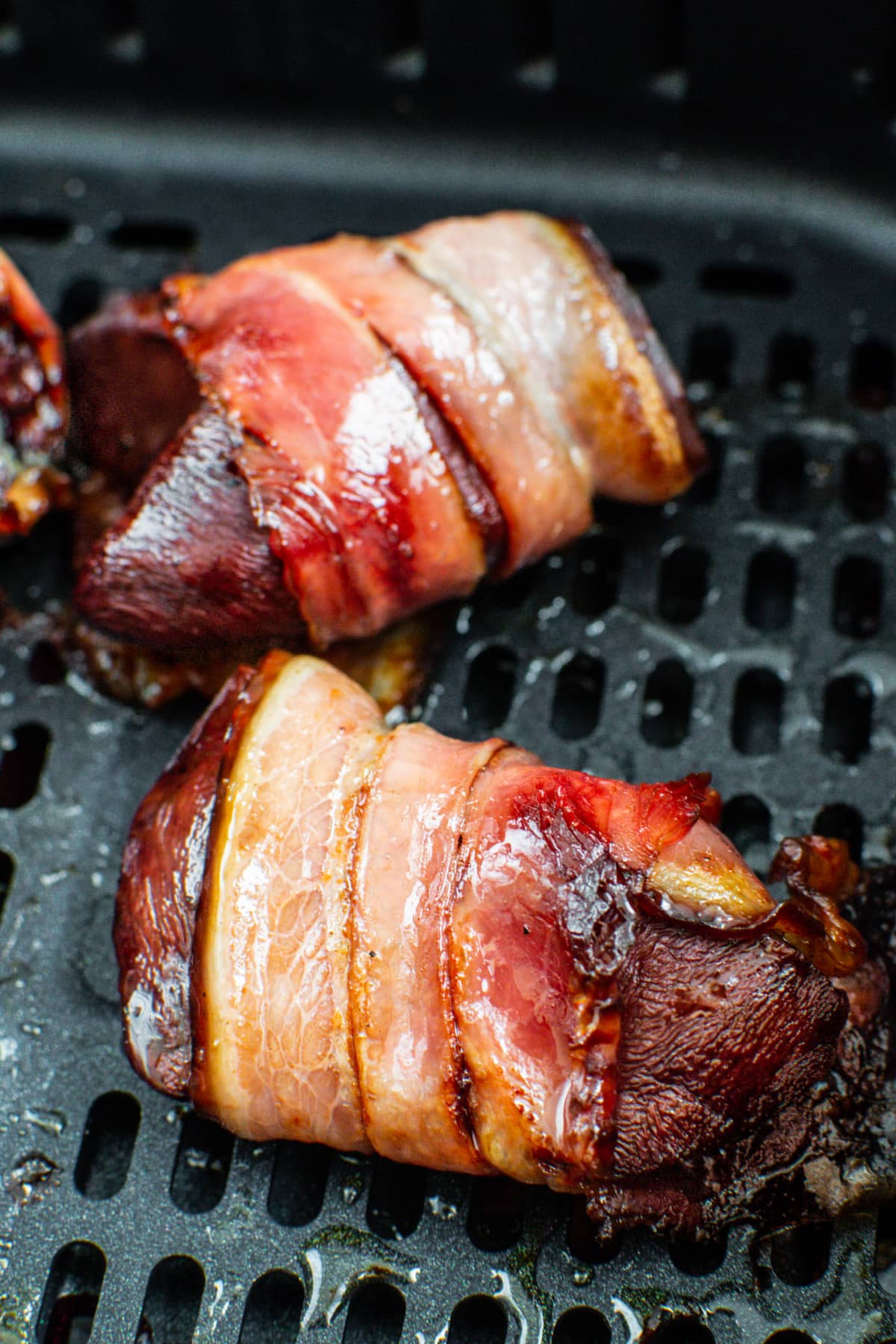 Close look of appetizing bacon-wrapped turkey liver.