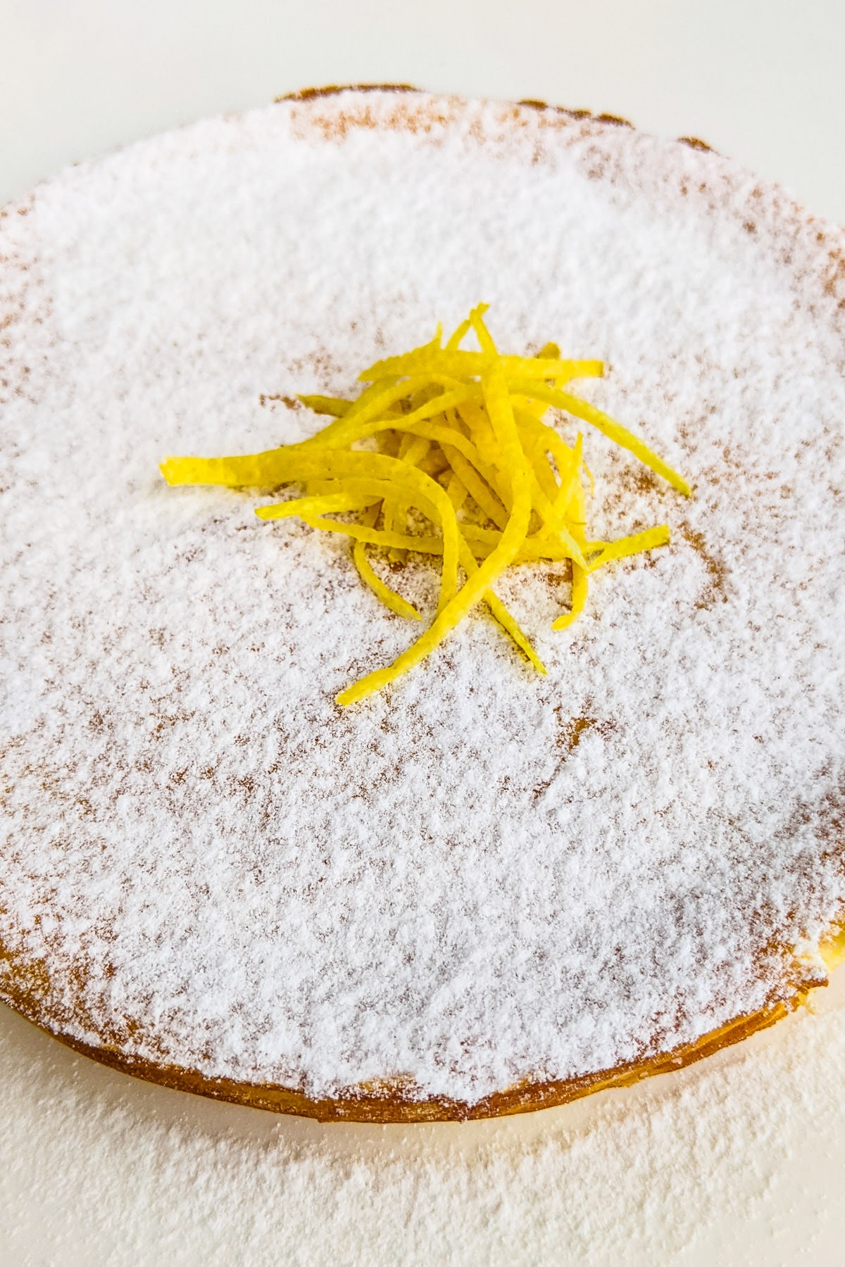 Ricotta cheese cake decorated with powdered sugar