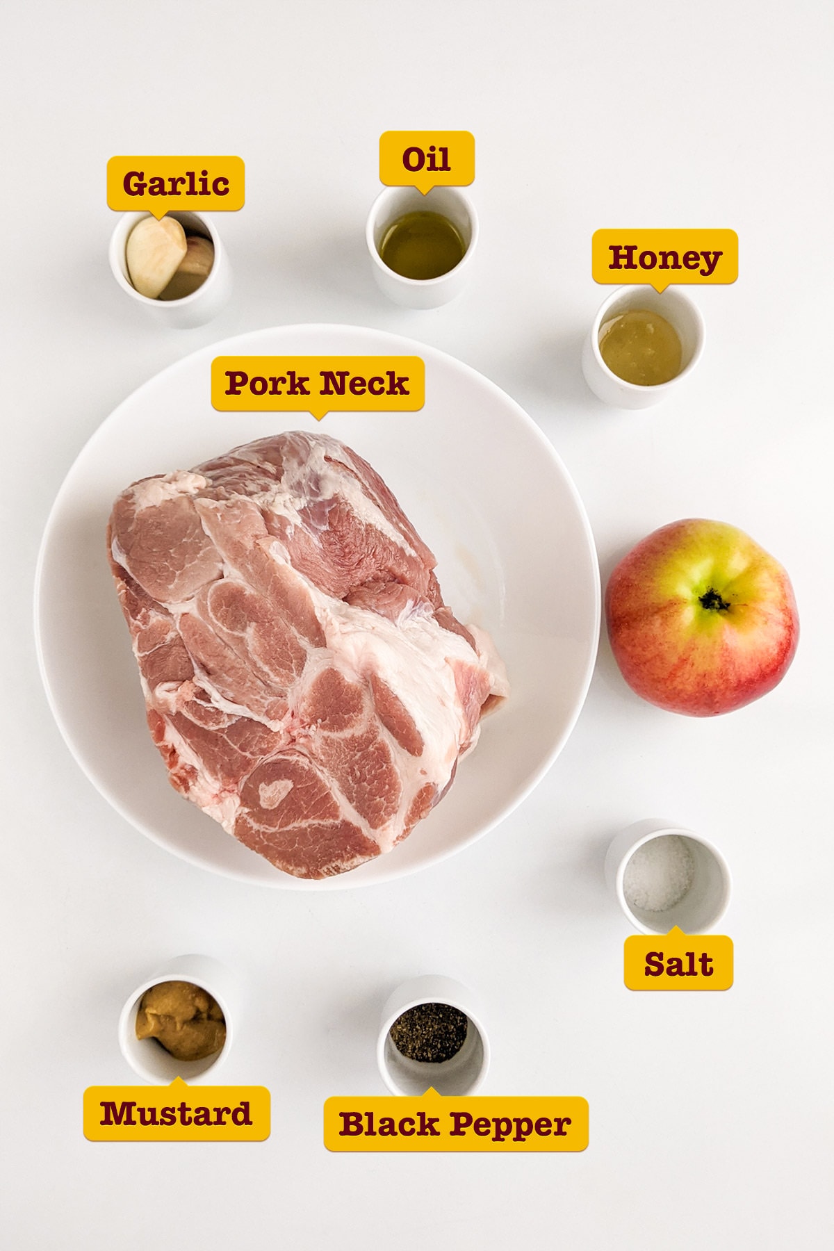 Ingredients for juicy roast pork on white table.