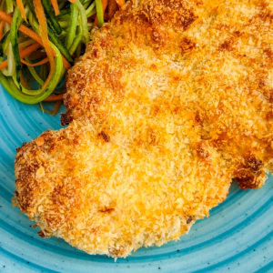 Close look at air fried chicken schnitzel coated with panko.