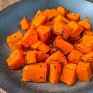 A plate with roasted butternut squash in air fryer.