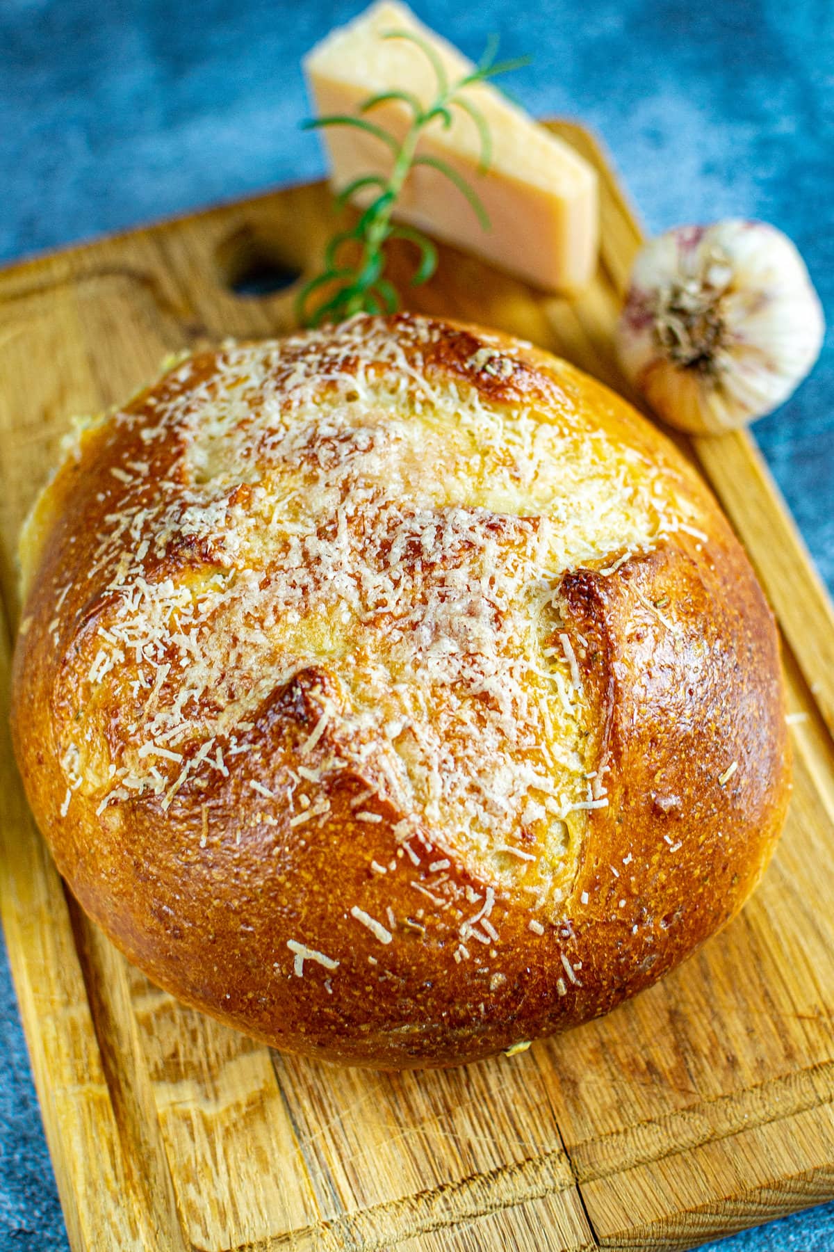 Parmesan rosemary bread on a cutting board.