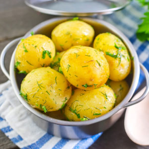 Close view of boiled potatoes with dill.