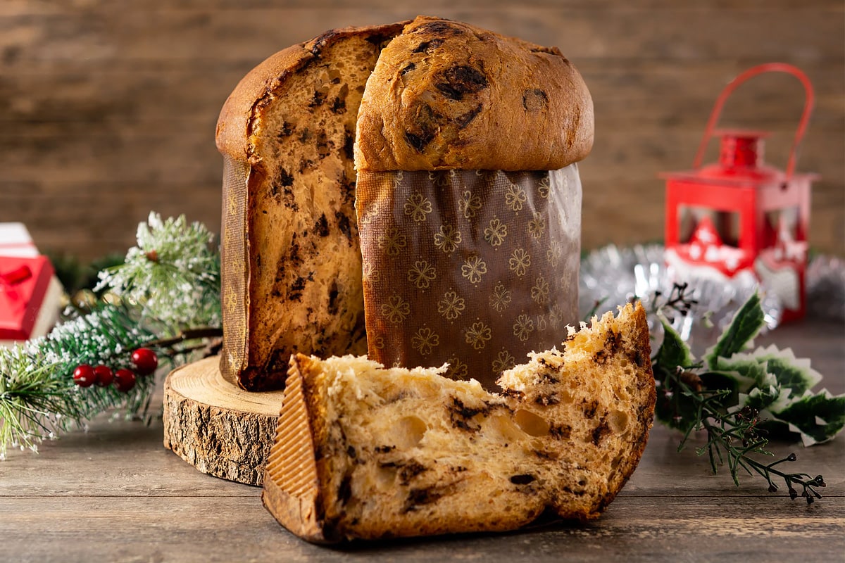 Close look of a classic panettone with Christmas background.