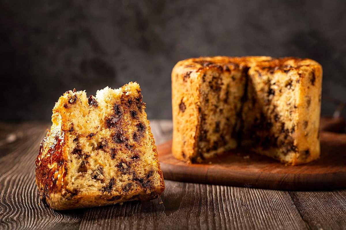 A slice of thawed Italian panettone with chocolate inside.