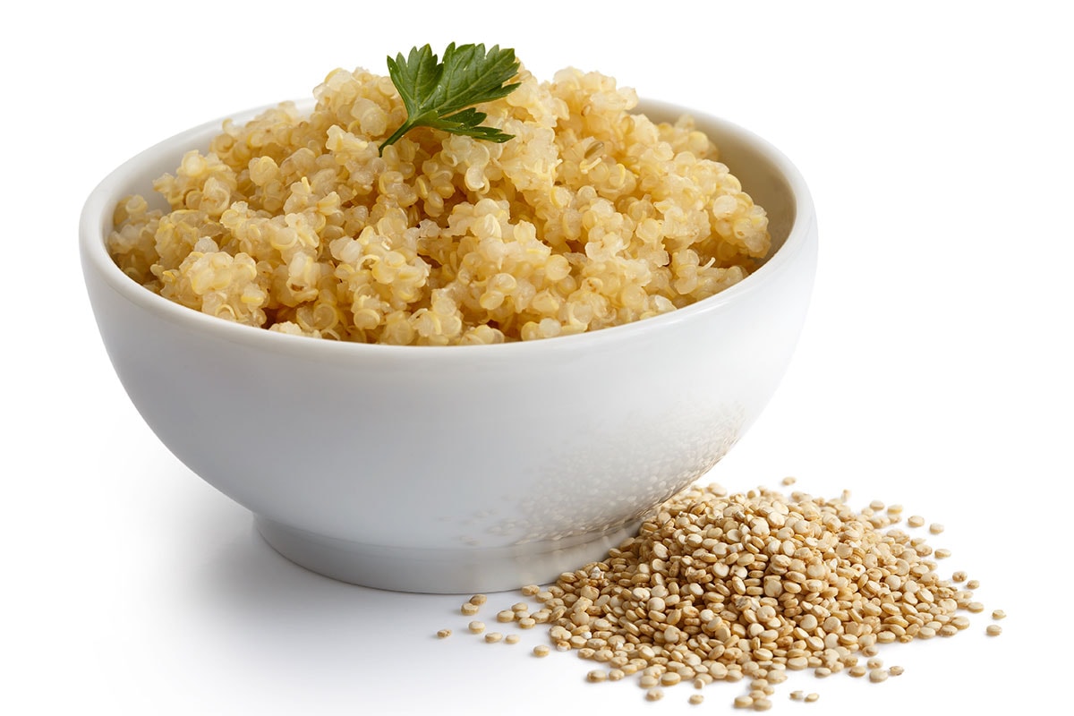 White plate with boiled quinoa.