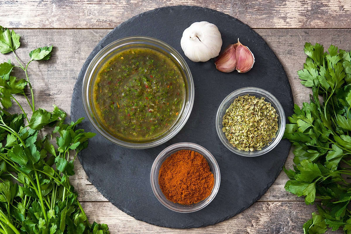 Top view of ingredients you need for the chimichurri sauce.