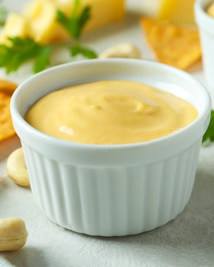 Close look of homemade American cheese sauce with nuts.