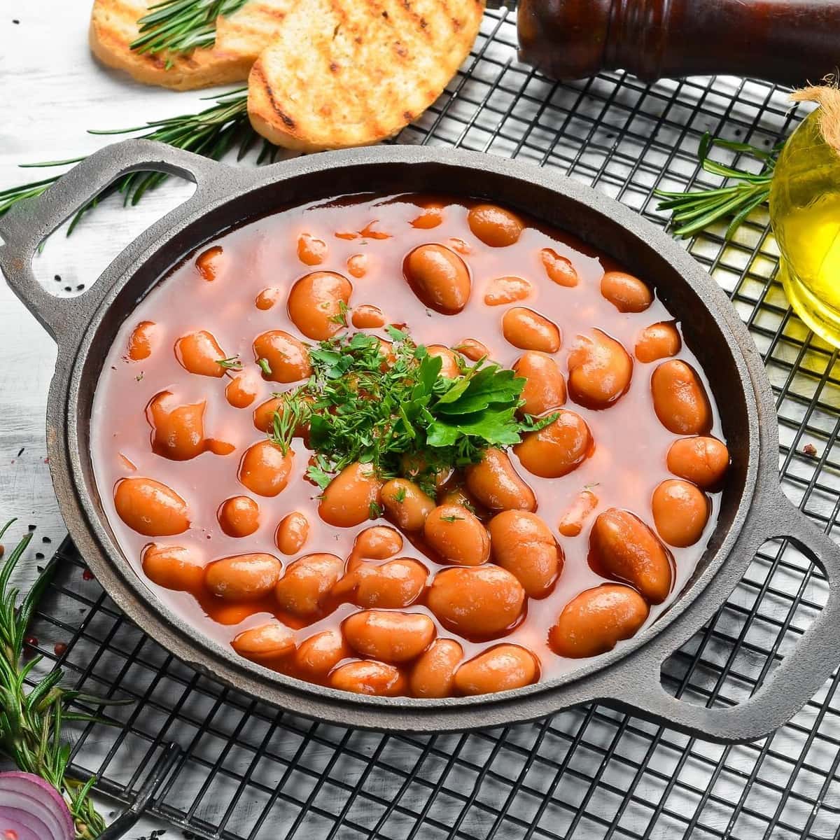 Cooked pinto beans in a metal plate.