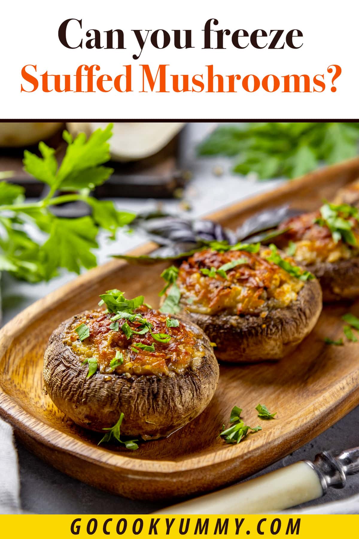 Close view of stuffed mushrooms with melted cheese and parsley.
