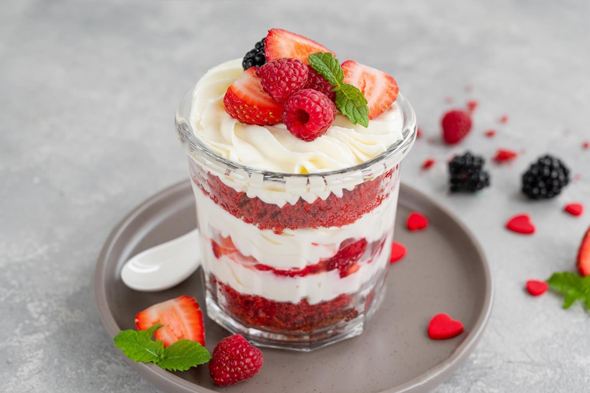 Strawberry trifle with raspberry and blackberries.