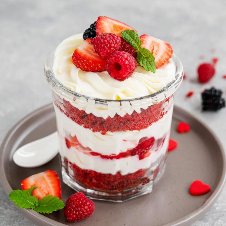 Strawberry trifle with whipped cream in a glass.