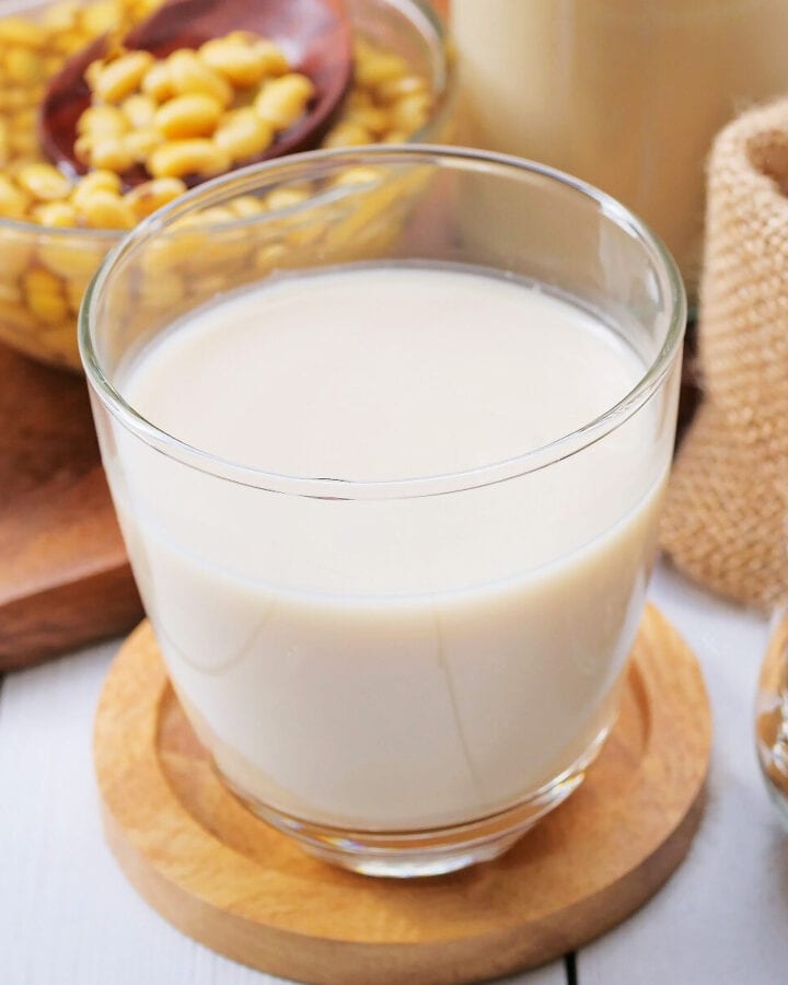 Close look of a transparent glass with soy milk.