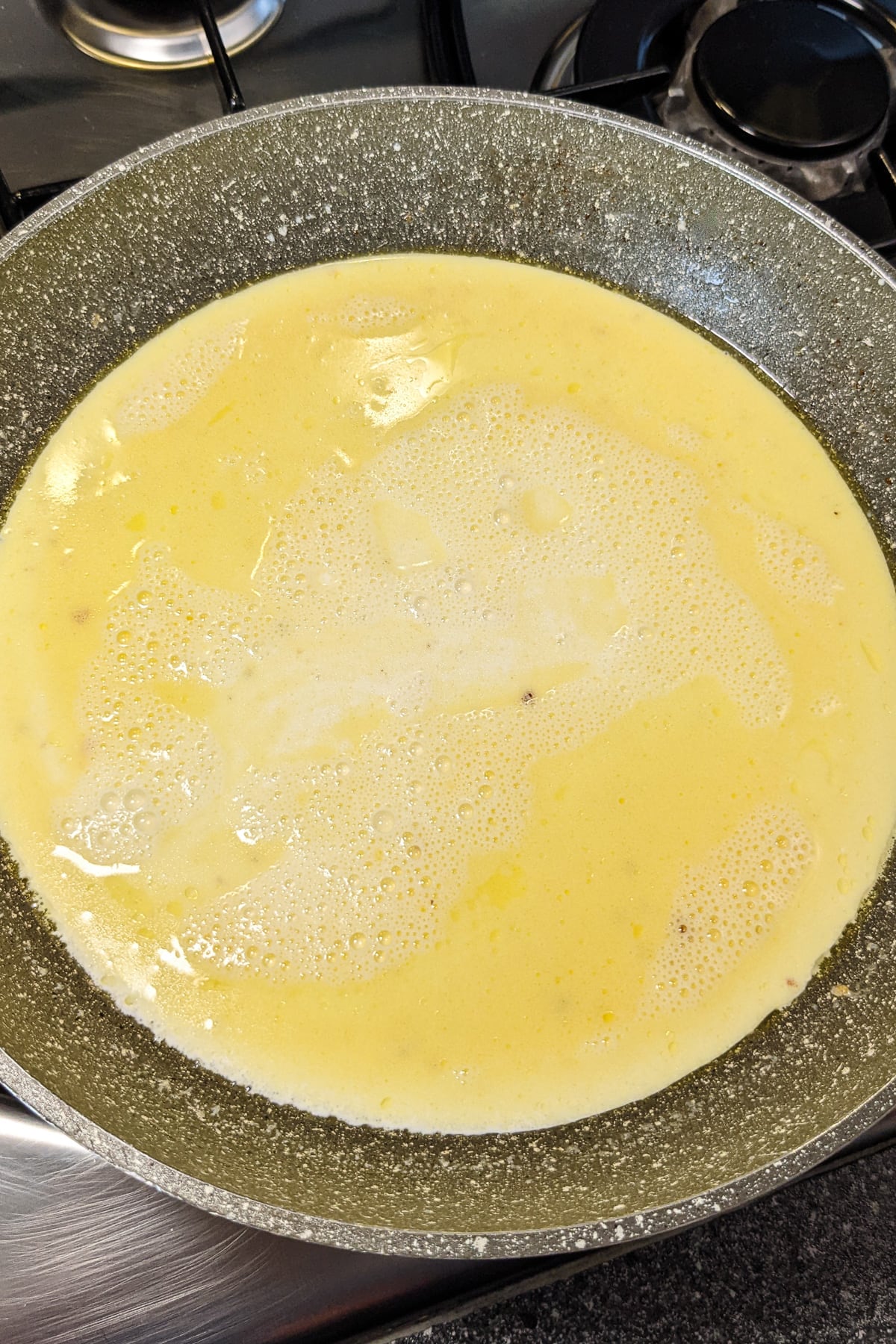Mixed half and half with with melted butter in a sauce pan.