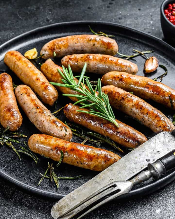 Close look of cooked sausages with rosemary.