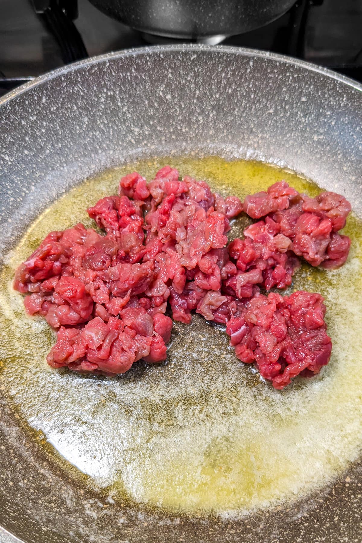Ground beef with butter fried on melted butter.