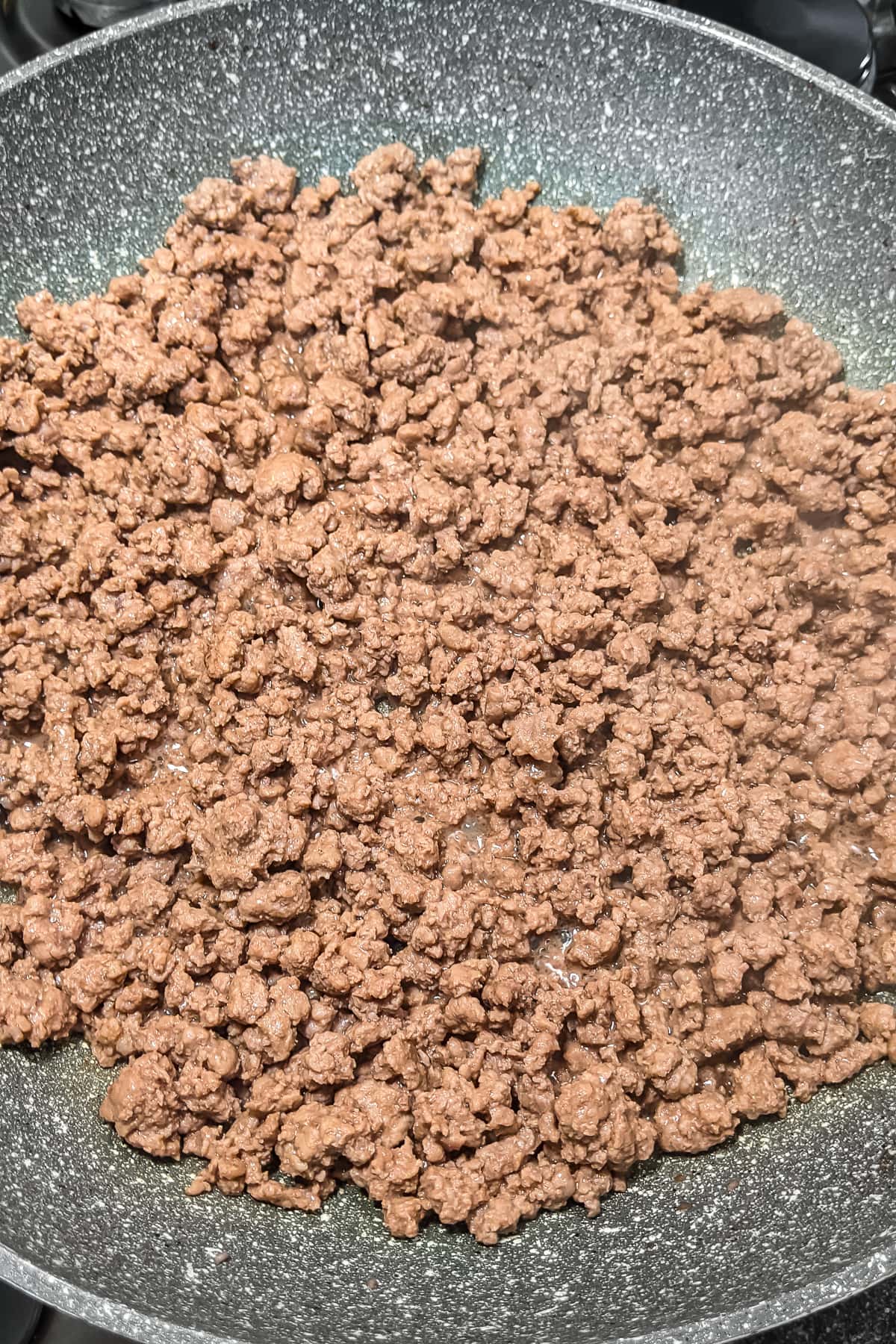 Fried ground beef in a frying pan.