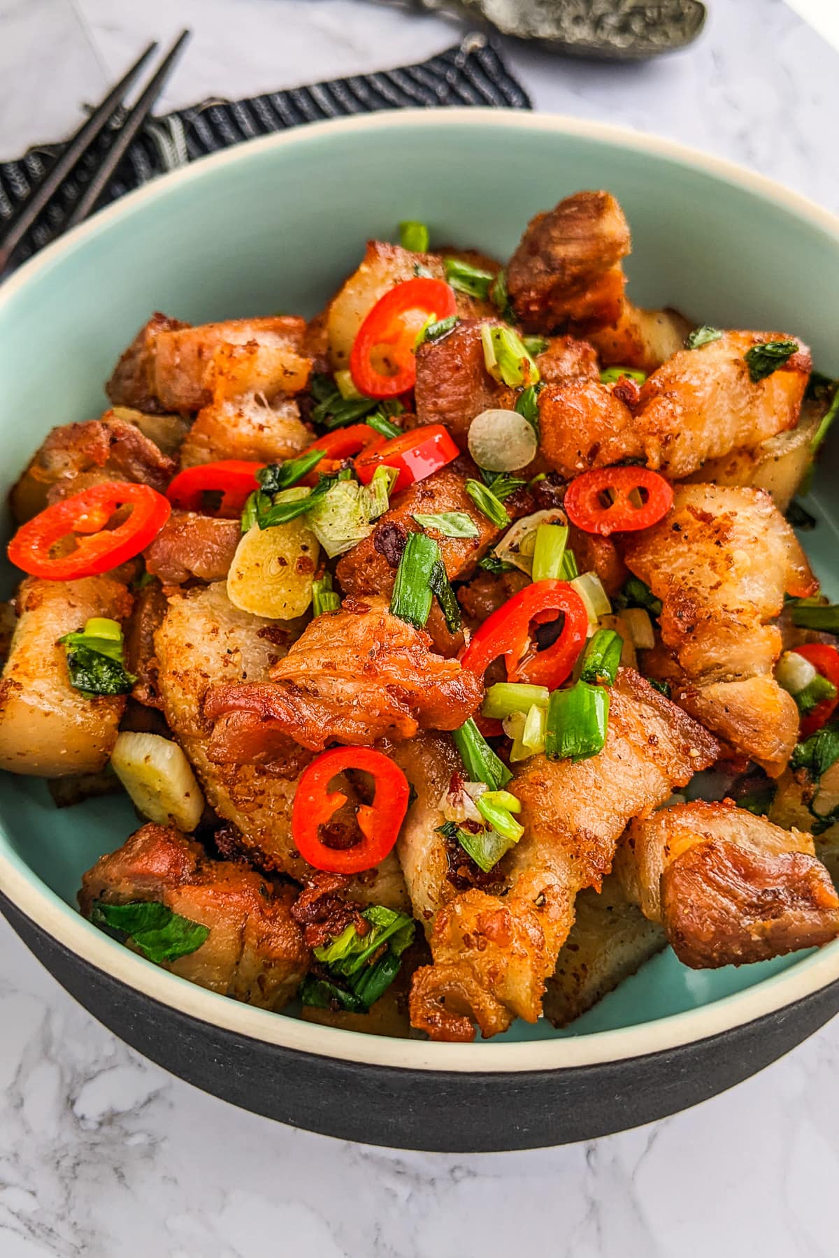 Pork belly with spring onions, chili pepper and garlic.