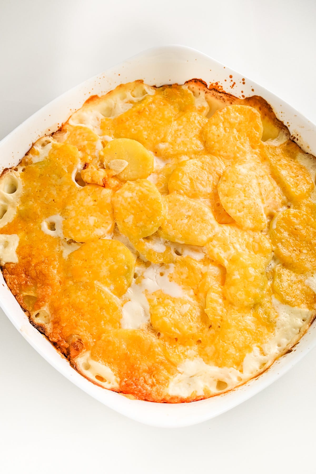 Potato bake casserole with melted cheddar cheese.