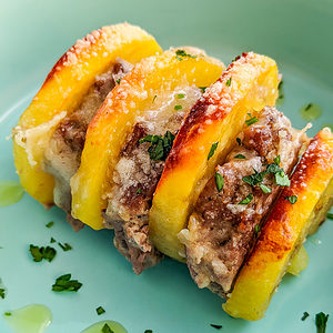 Elegant plate with ground beef and sliced potatoes.