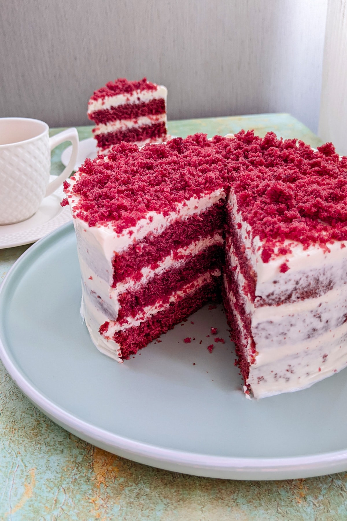 Close look of red velvet cake on a marble table.