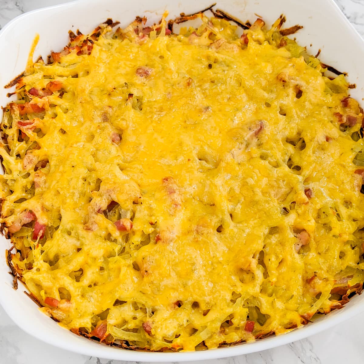 White casserole with hash brown and bacon.