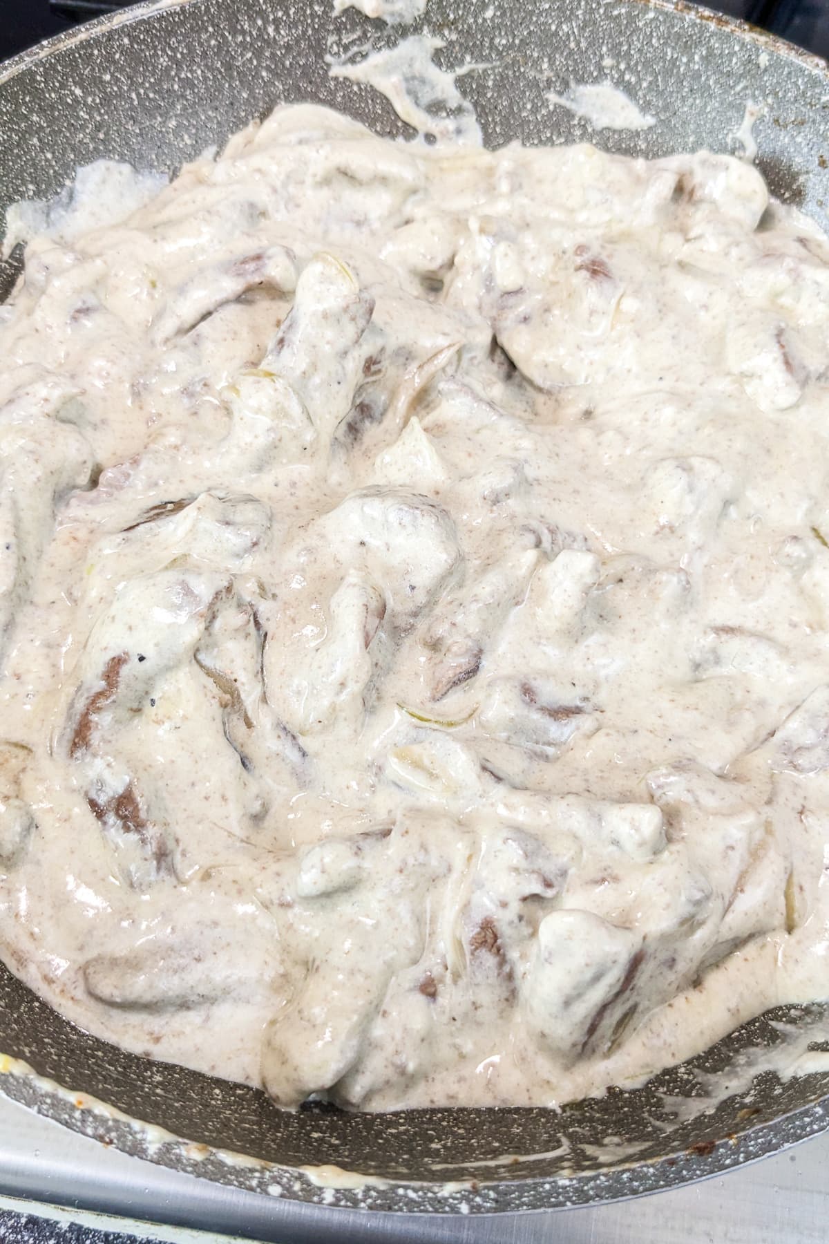 Close look of beef Stroganoff without mushrooms in a frying pan.