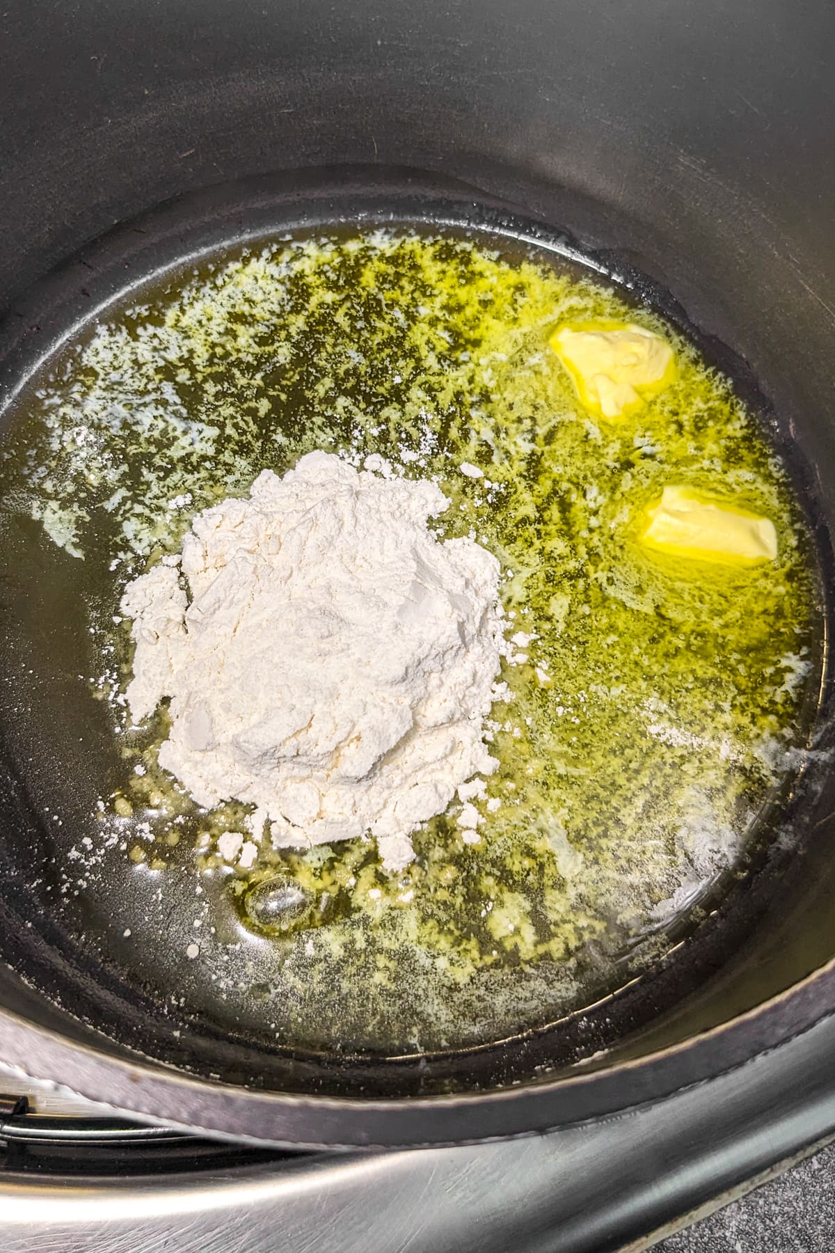 Melted butter and all purpose flour in a deep saucepan.