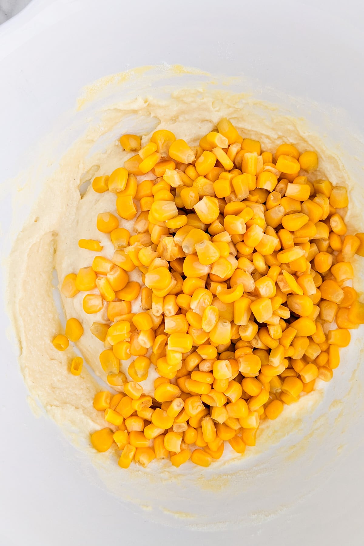 Canned corn over a mix of yogurt, flour and an egg.