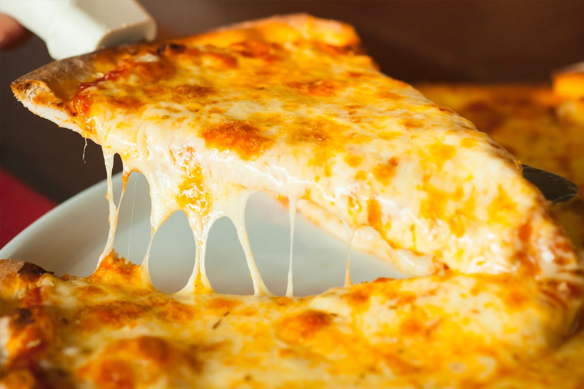 Close look of melted cheese on pizza.